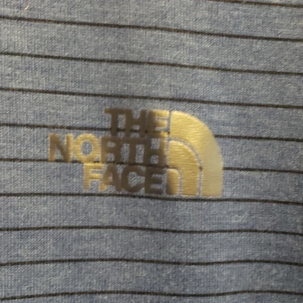 The north face flashdry tshirt blue & black stripe